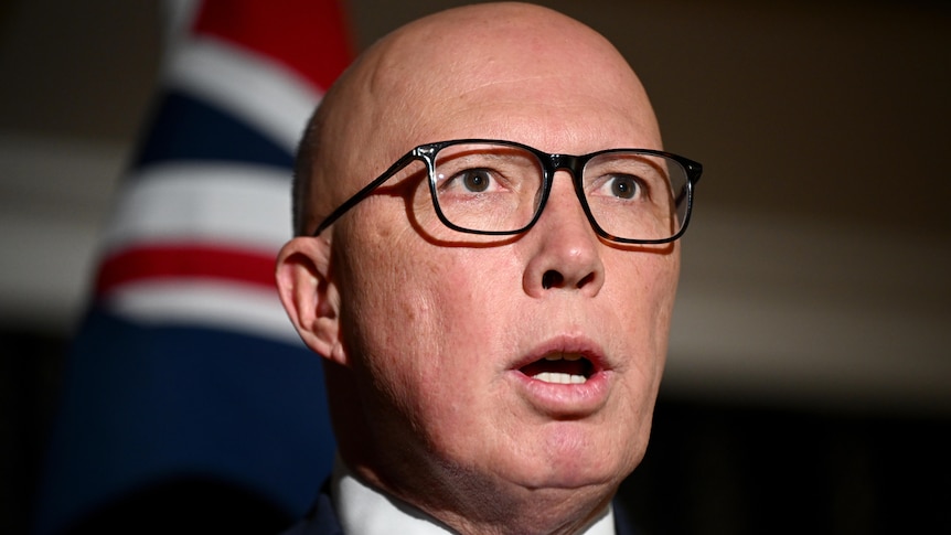 Close up of Peter Dutton in glasses.
