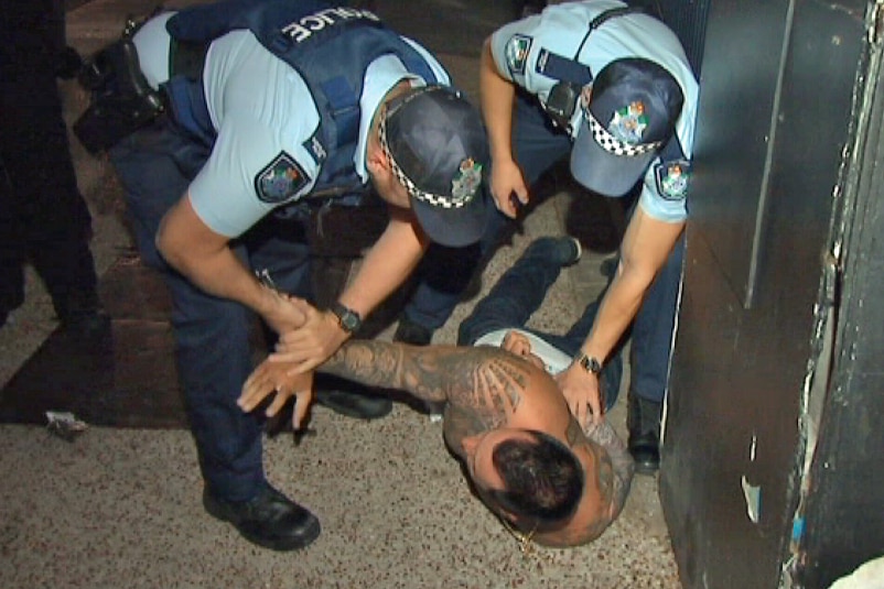 TV Footage of a man being restrained by NSW Police