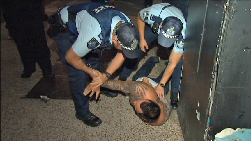 TV Footage of a man being restrained by NSW Police