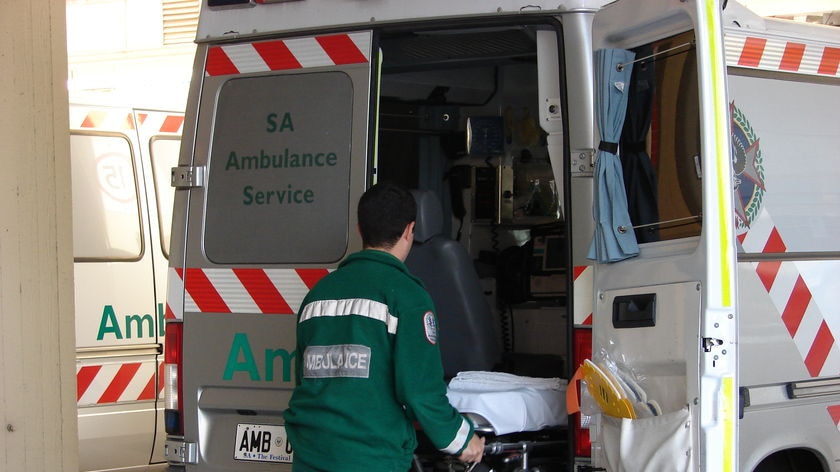 A stretcher is put into the back of an ambulance in Adelaide.