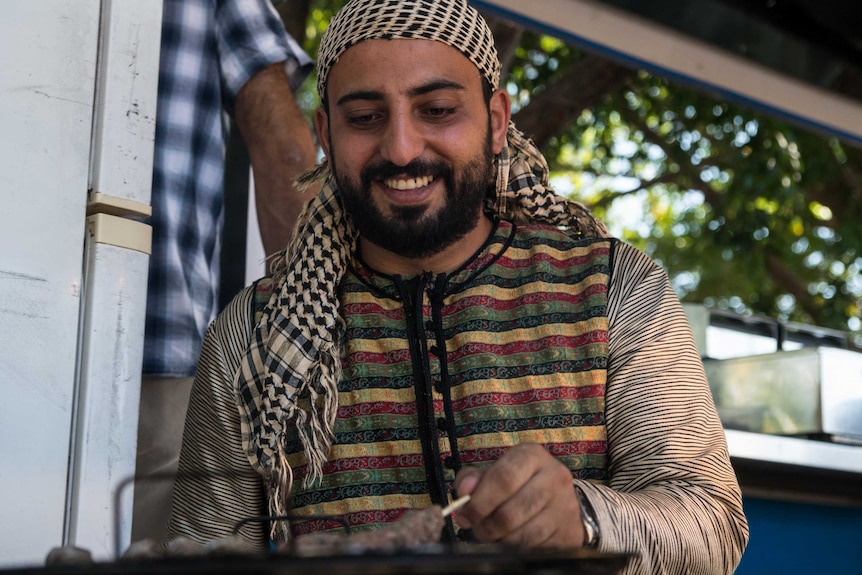 Syrian food vendor Nadeem Turkia in his van at the Malak markets.