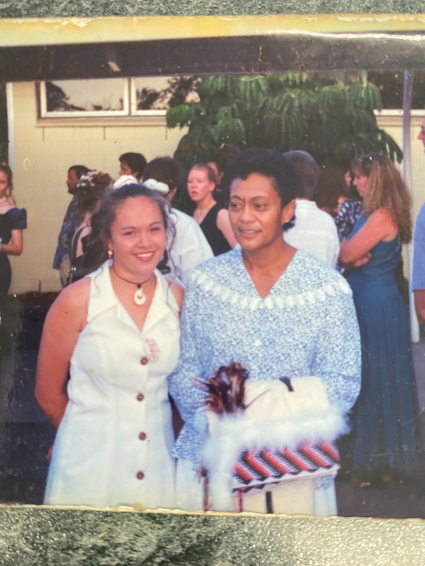 Moana pictured when she was younger, smiling in a photo with her mother.