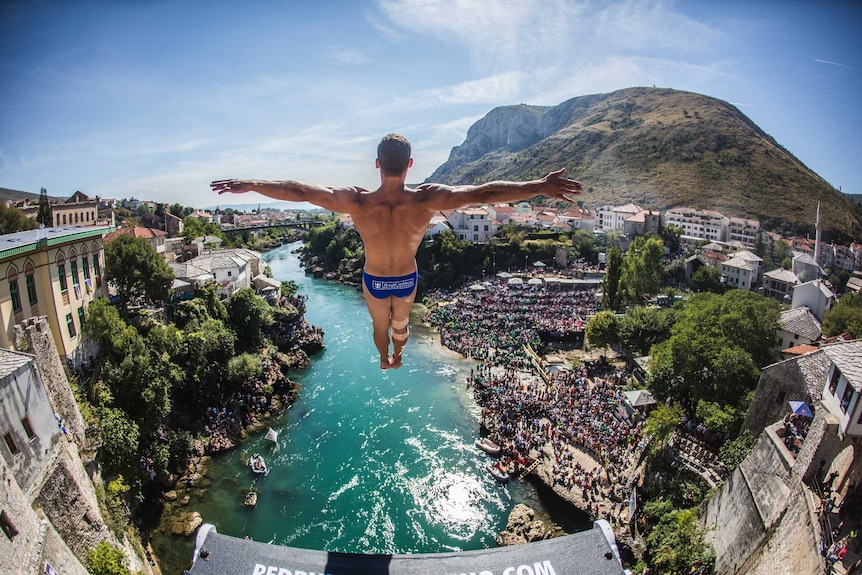 Michal Navratil of the Czech Republic dives from the 27.5 metre platform on Stari Most.
