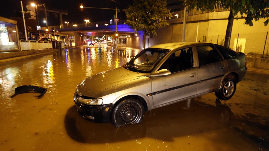 Car on flooded street in Nice, France