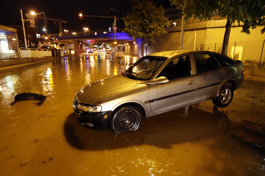 Car on flooded street in Nice, France