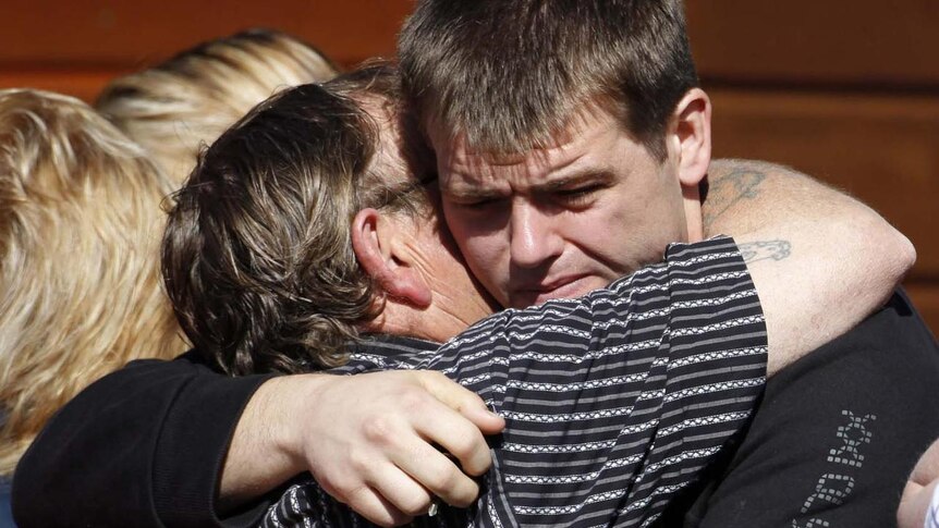 Daniel Rockhouse being consoled by family after surving the Pike River disaster.