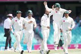 Australia's Nathan Lyon (3R) celebrates after dismissing Pakistan's Younis Khan on day five at the SCG.