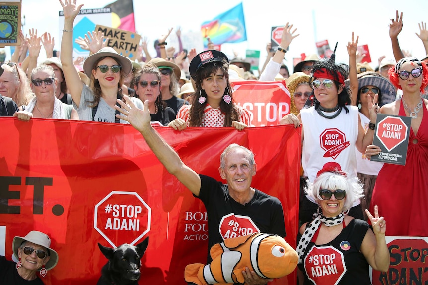 Bob Brown poses with supporters in Airlie Beach