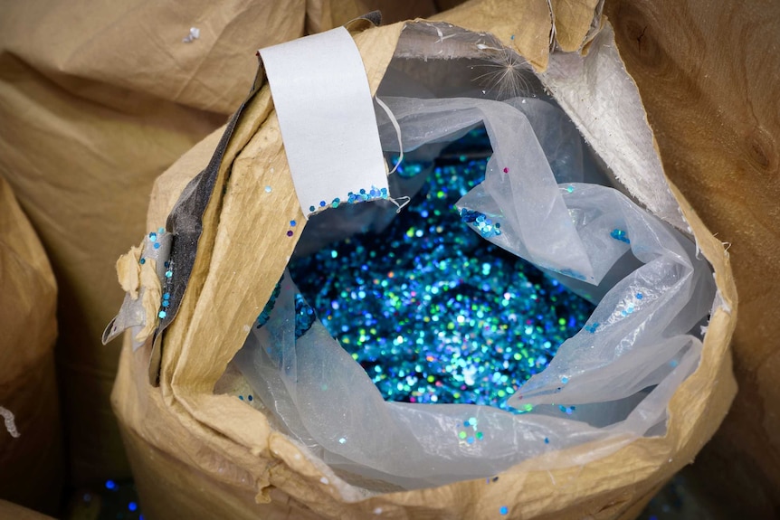 Large bags of glitter used to prepare floats for Sydney's Mardis Gras.