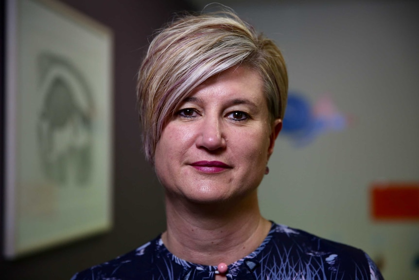 Portrait photo of woman with short hair.