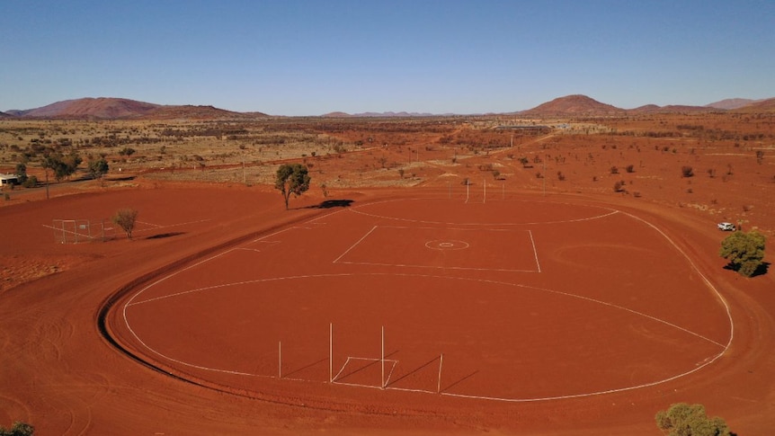 An aerial view of the red dirt oval at Amata.