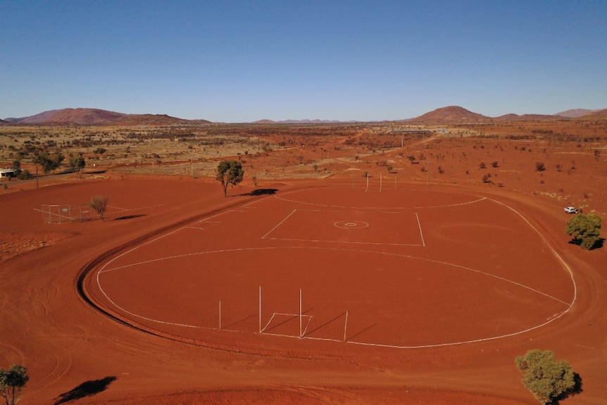An aerial view of the red dirt oval at Amata.