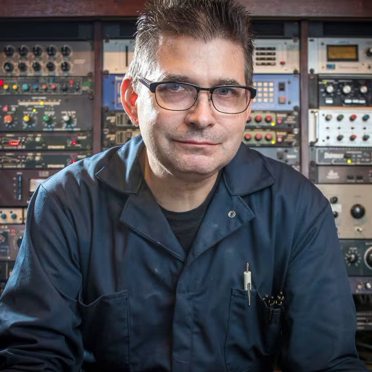 Music producer Steve Albini sitting in front of a mixing desk