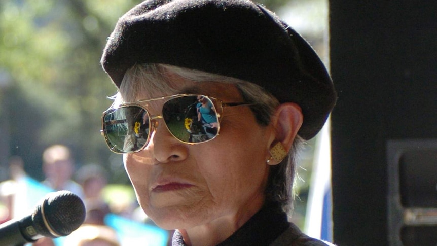 Hiroshima survivor, Junko Morimoto, at a peace rally in Sydney holding her book My Hiroshima