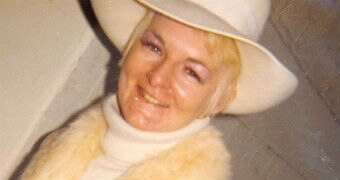 An archive photo of Shirley Finn, wearing a cream hat, cream jumper and fur scarf.