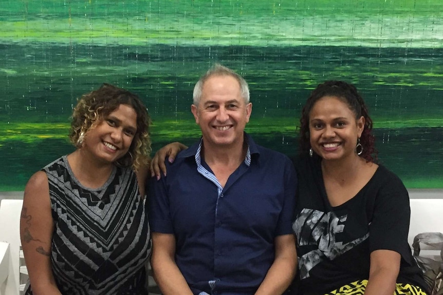 Michael Eather (centre) flanked by his daughters Alice and Noni