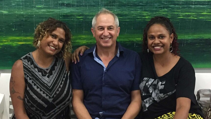 Michael Eather (centre) flanked by his daughters Alice and Noni