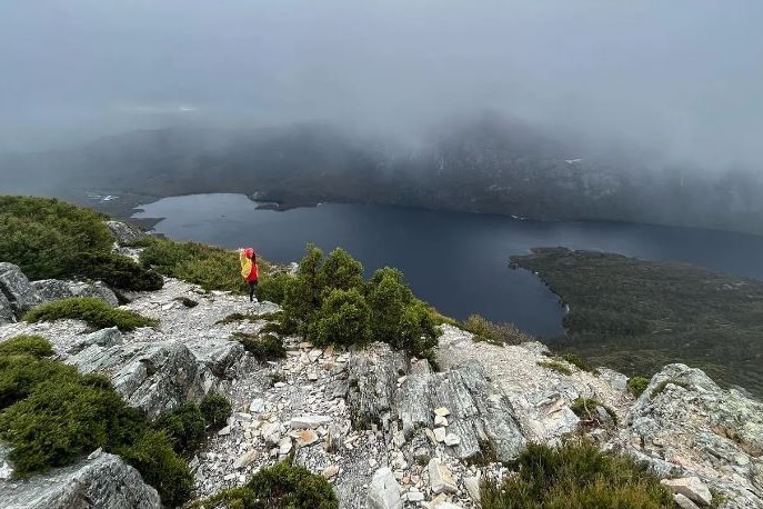 Lewi Taylor near a mountain lake in the Tasmanian highlands.