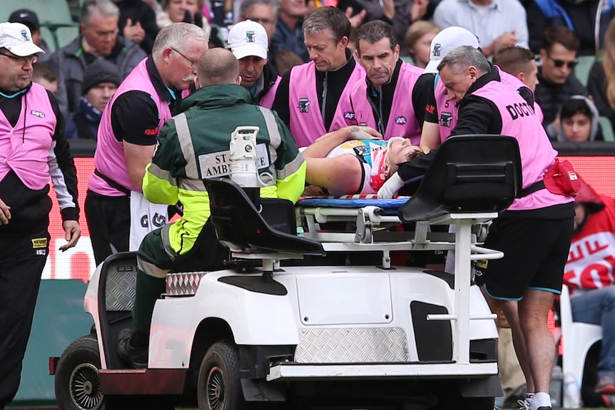 Port Adelaide's Robbie Gray is taken off the MCG on a stretcher against Carlton on June 20, 2015.