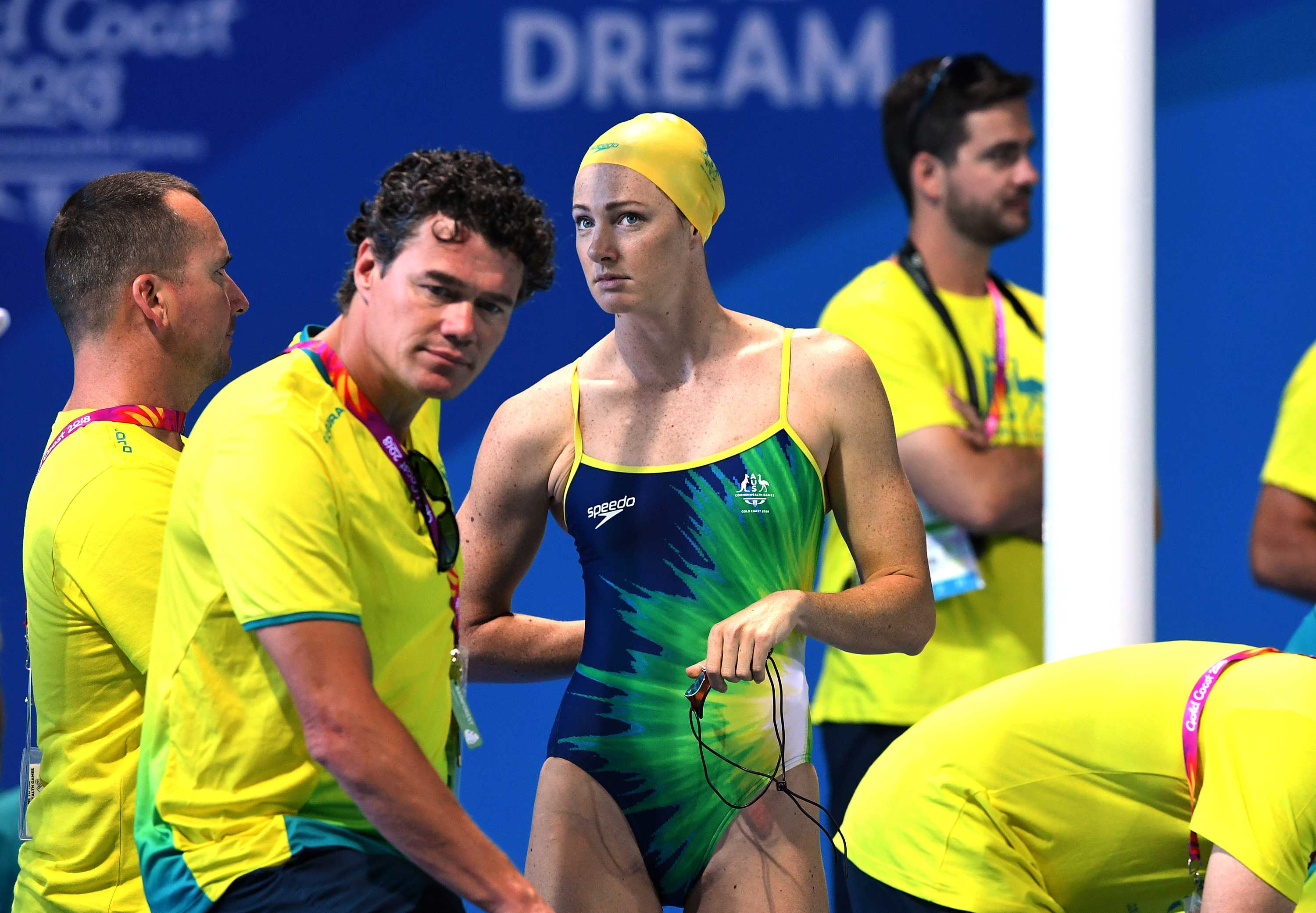 Cate Campbell, in her full swim gear, stands near coach Jacco Verhaeren