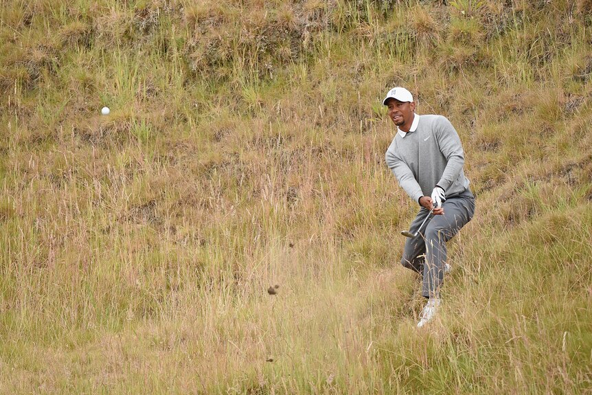 Tiger Woods plays a shot in the rough during the second round of the 2015 US Open on June 19, 2015.