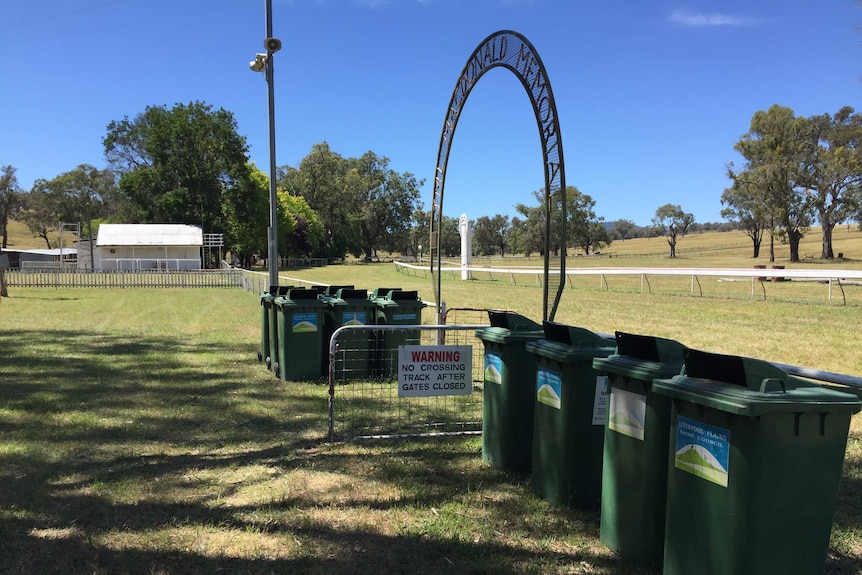 Rubbish bins line the Wallabadah racetrack in preparation of tomorrow's 164th annual race meeting