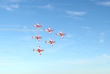 The RAAF Roulettes fly over Uluru