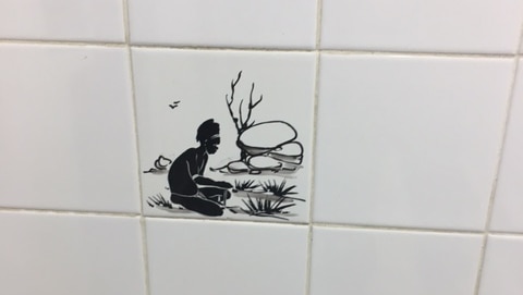 A tile featuring a black and white image of an Aboriginal man in the Sussex Inlet RSL club.