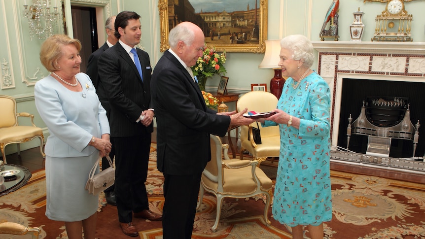 John Howard receives Order of Merit from the Queen.