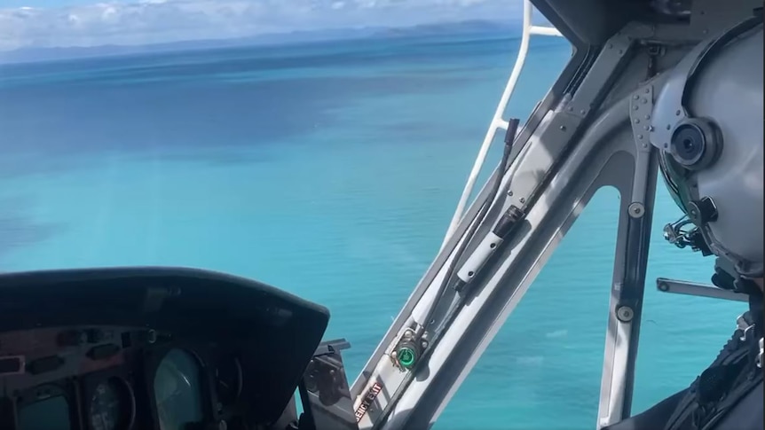 View from a helicopter looking out over the ocean.