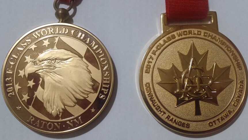2013 gold medal on the left and the 2017 gold medal on the right
