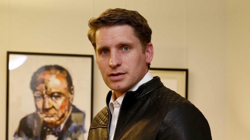 Liberal MP Andrew Hastie stares into the camera.