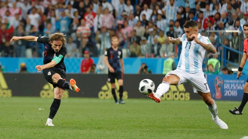 Luka Modric hammers the ball home against Argentina