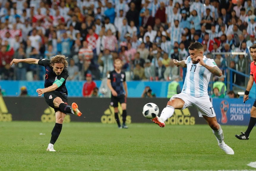 Luka Modric hammers the ball home against Argentina