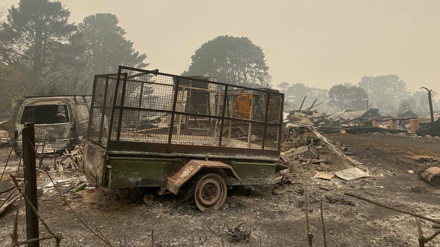 destroyed vehicles and trailers after a fire