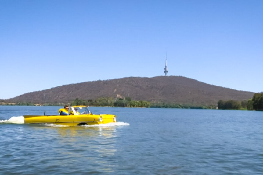 Ian Oliver driving his car through Lake Burley Griffin.