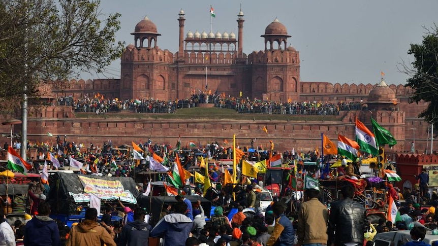 the Red Fort in New Delhi wit hundreds of protesters out the front