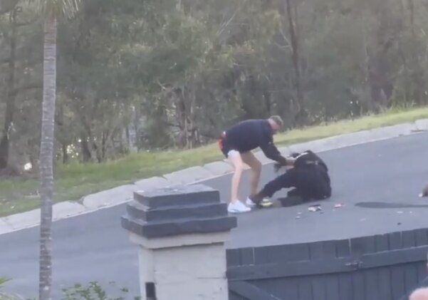 Man assaulting police officer on ground