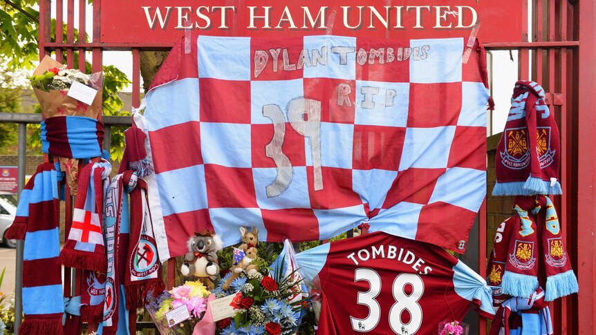 Floral tributes are left for West Ham striker, Dylan Tombides, outside the Boleyn Ground.