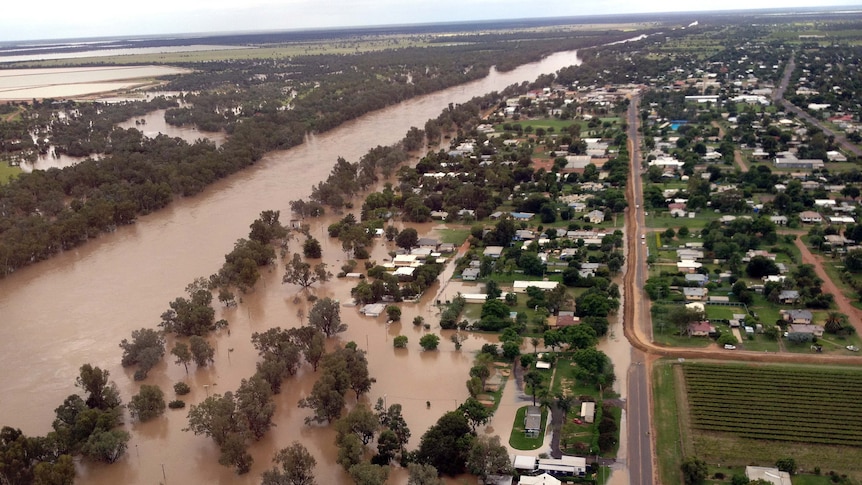 The flooded Balonne River approaches the levee in St George