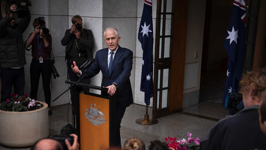 Prime Minister Malcolm Turnbull gestures at a press conference at Parliament House on August 23, 2018.