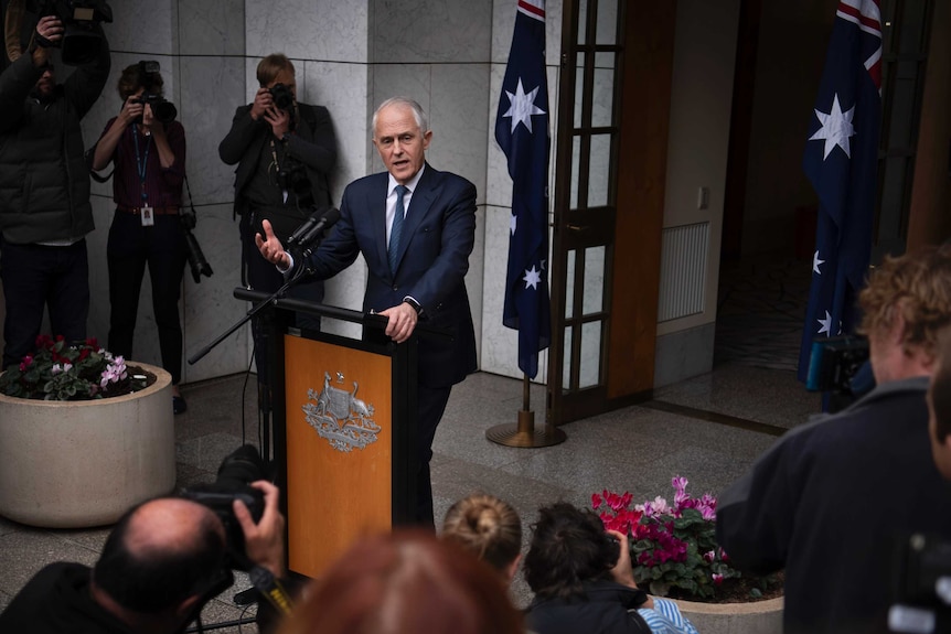 Prime Minister Malcolm Turnbull gestures at a press conference at Parliament House on August 23, 2018.