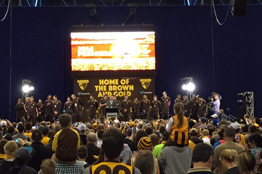 Thousands of Hawks supporters greet team members in Launceston's Sliverdome