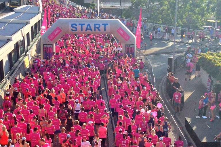 Almost 10,000 people line up at the start line for the 25th International Women's Day Fun Run in Brisbane