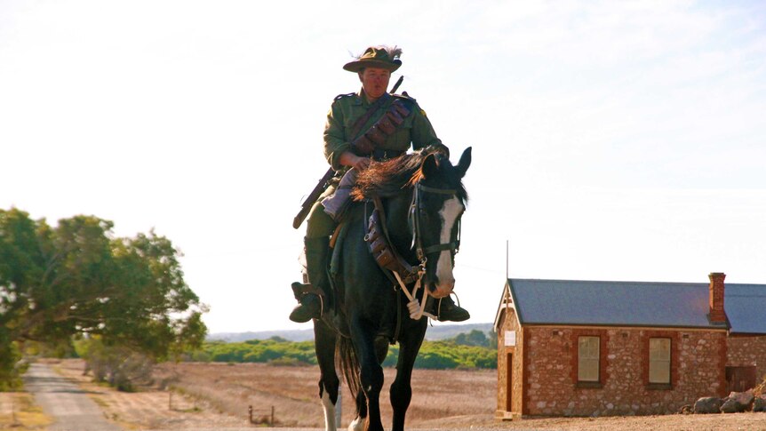 Verna Holmes rides Cuffy through the Central Greenough Historic Settlement