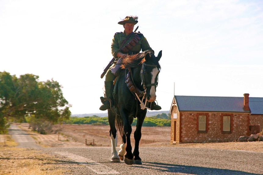 Verna Holmes rides Cuffy through the Central Greenough Historic Settlement