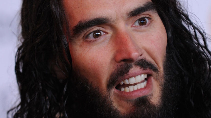 Russell Brand is alleged to have thrown a photographer's phone out of a window.