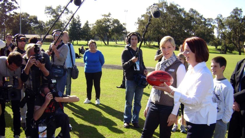 Gillard with football at junior footy club