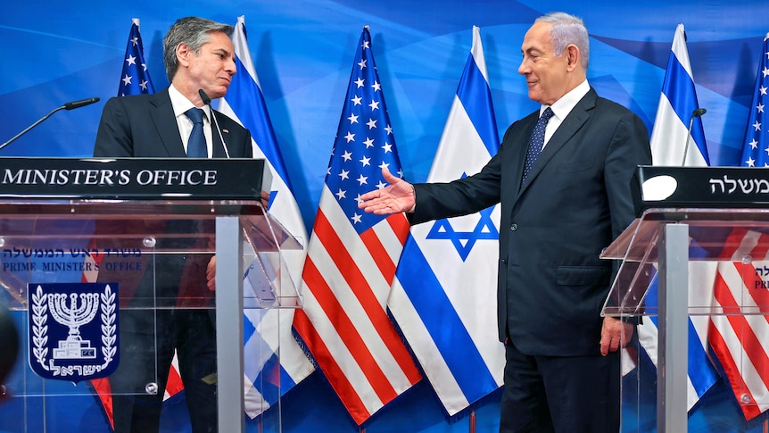 Israeli Prime Minister Benjamin Netanyahu goes to shake hands with US Secretary of State Anthony Blinken at a press conferece