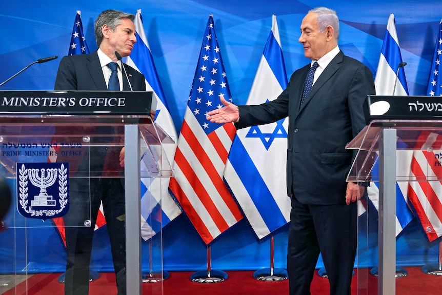 Israeli Prime Minister Benjamin Netanyahu goes to shake hands with US Secretary of State Anthony Blinken at a press conferece